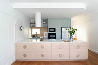 A Kitchen Reimagined: Elegant Curves, Hidden Details, and Playful Accents
