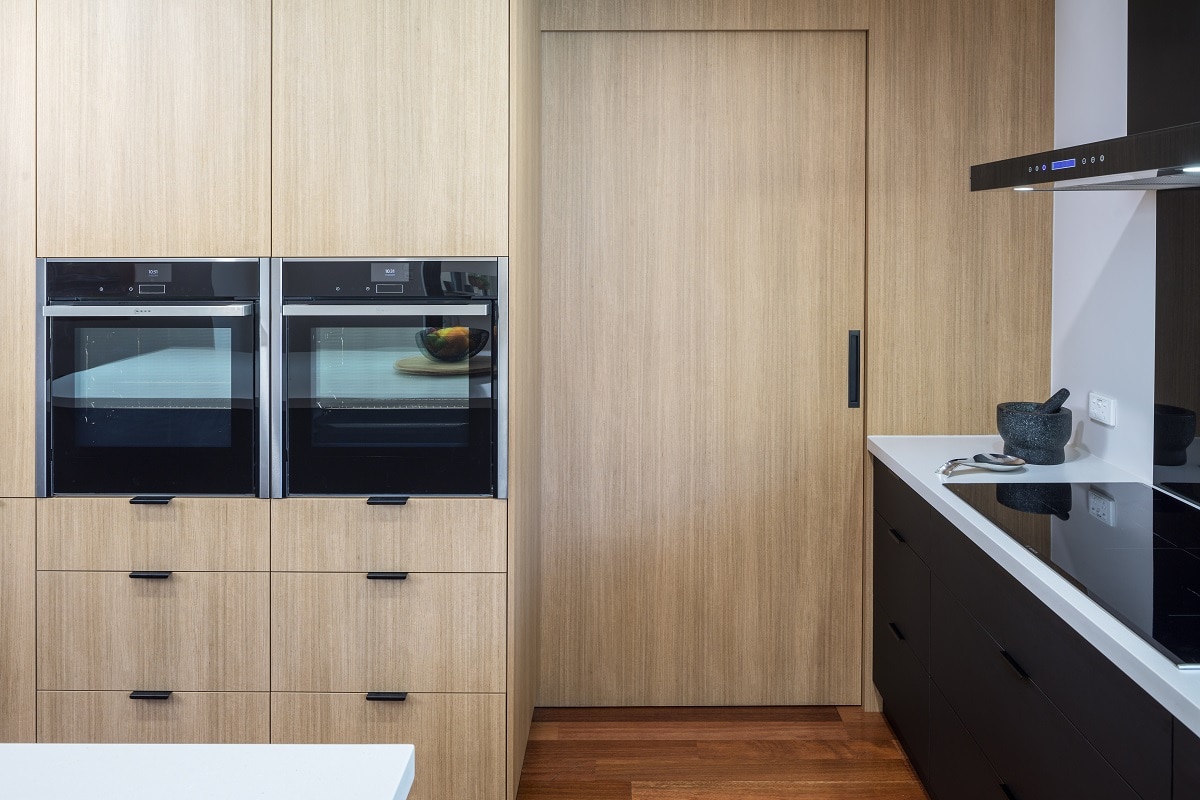 modern kitchen with matt black cabinet handles