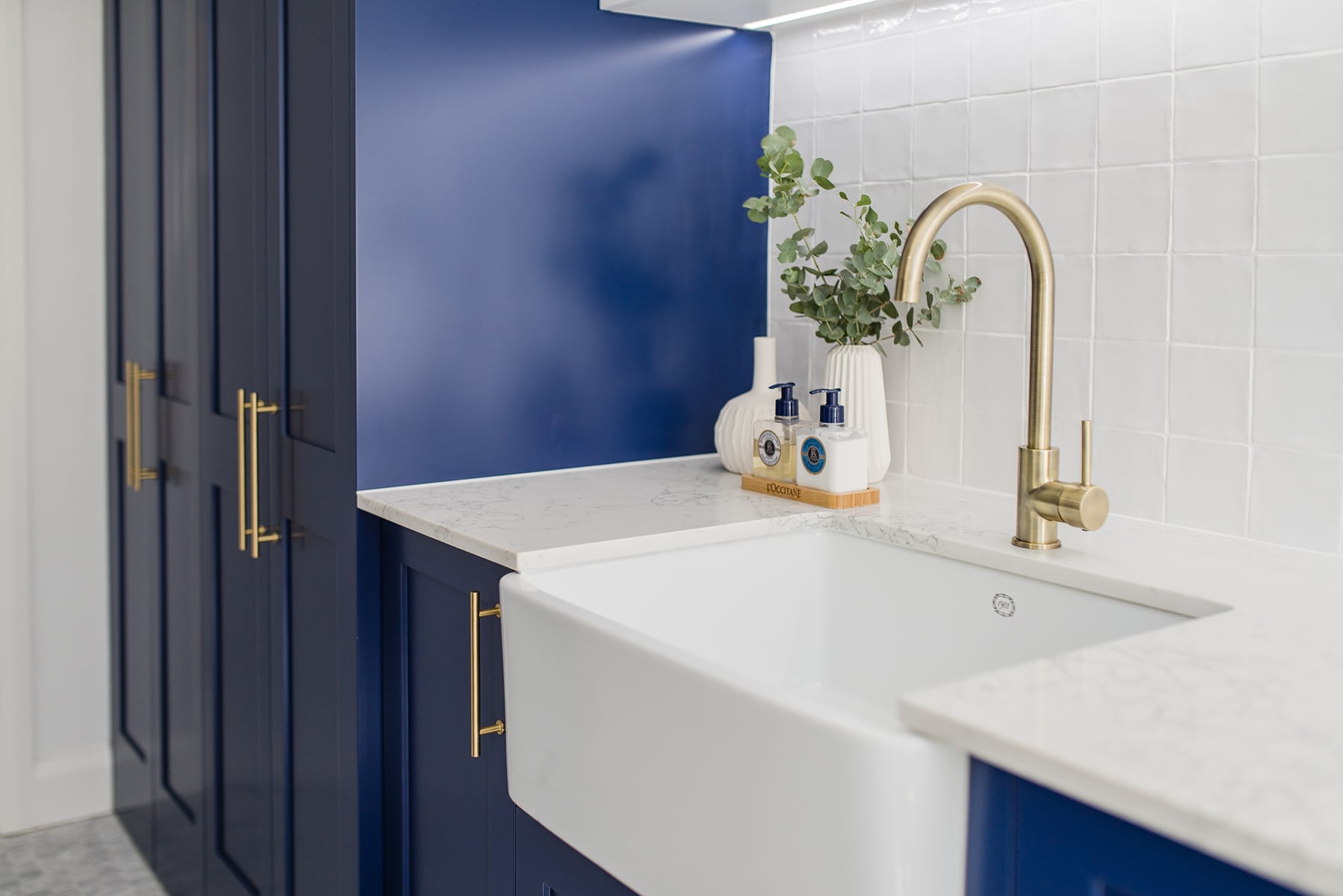 laundry with gold handles and blue accents