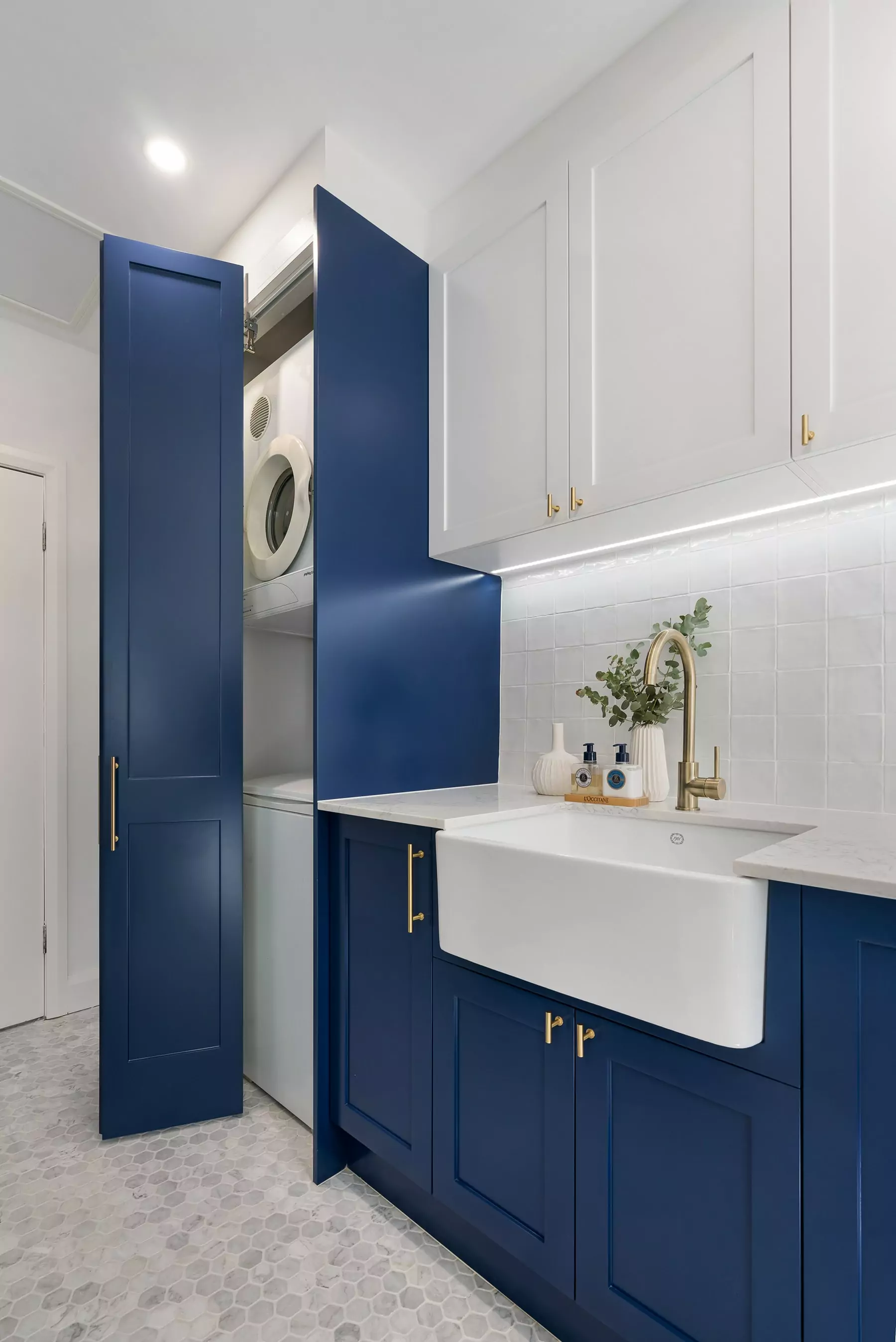 laundry with gold handles and blue accents